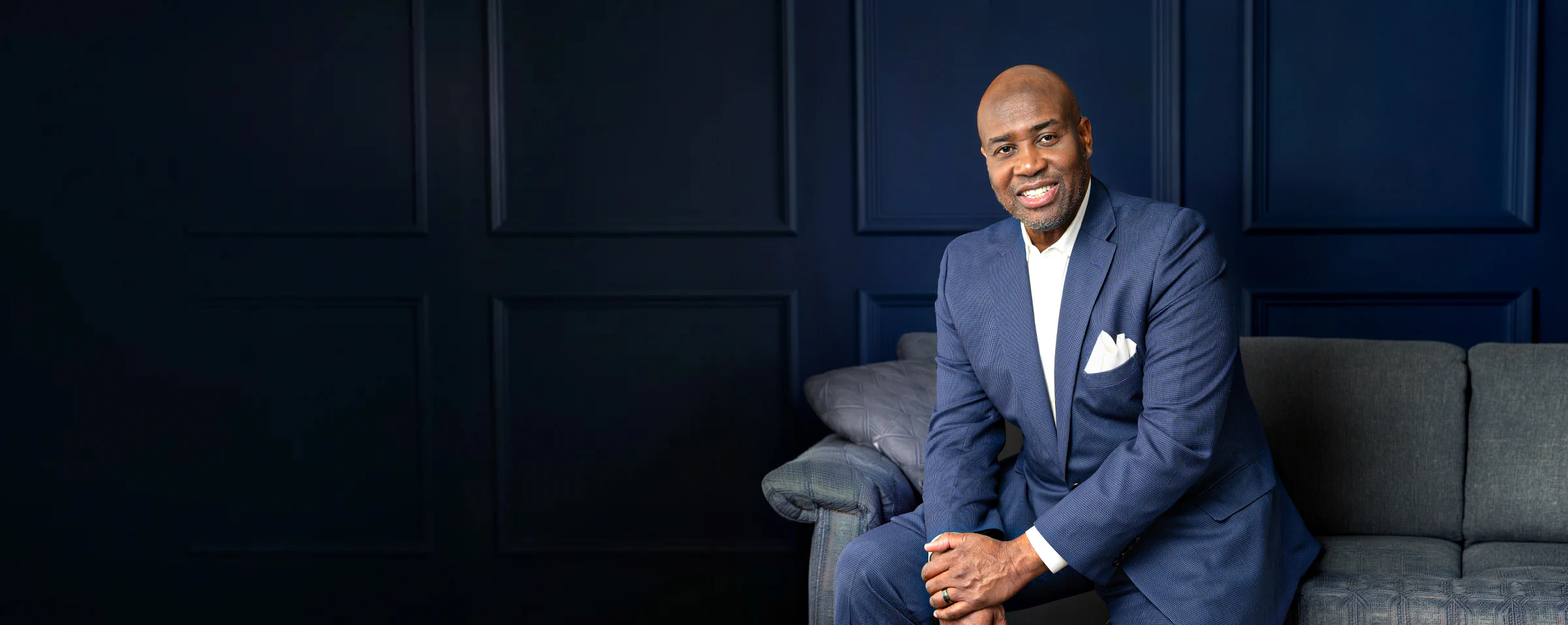 Dr. Earl Stephenson, Jr., MD, DDS, MBA, seated in the ESJ Aesthetics consultation room